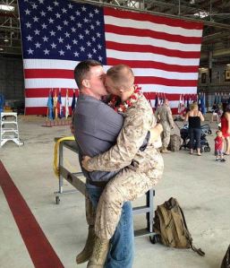 Sgt. Brandon Morgan with boyfriend Dalan Wells kissing